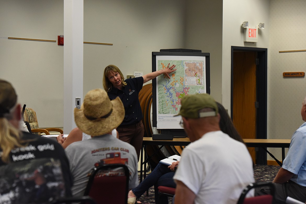 Kris Tempel of Montana Fish, Wildlife and Parks explains a proposed, roughly 27,000-acre conservation easement east and south of Libby during a July 14 public meeting. (Derrick Perkins/The Western News)