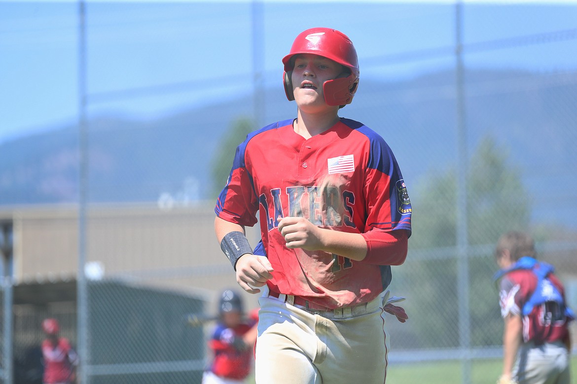 Jacob Hansen heads toward the dugout after scoring a run.