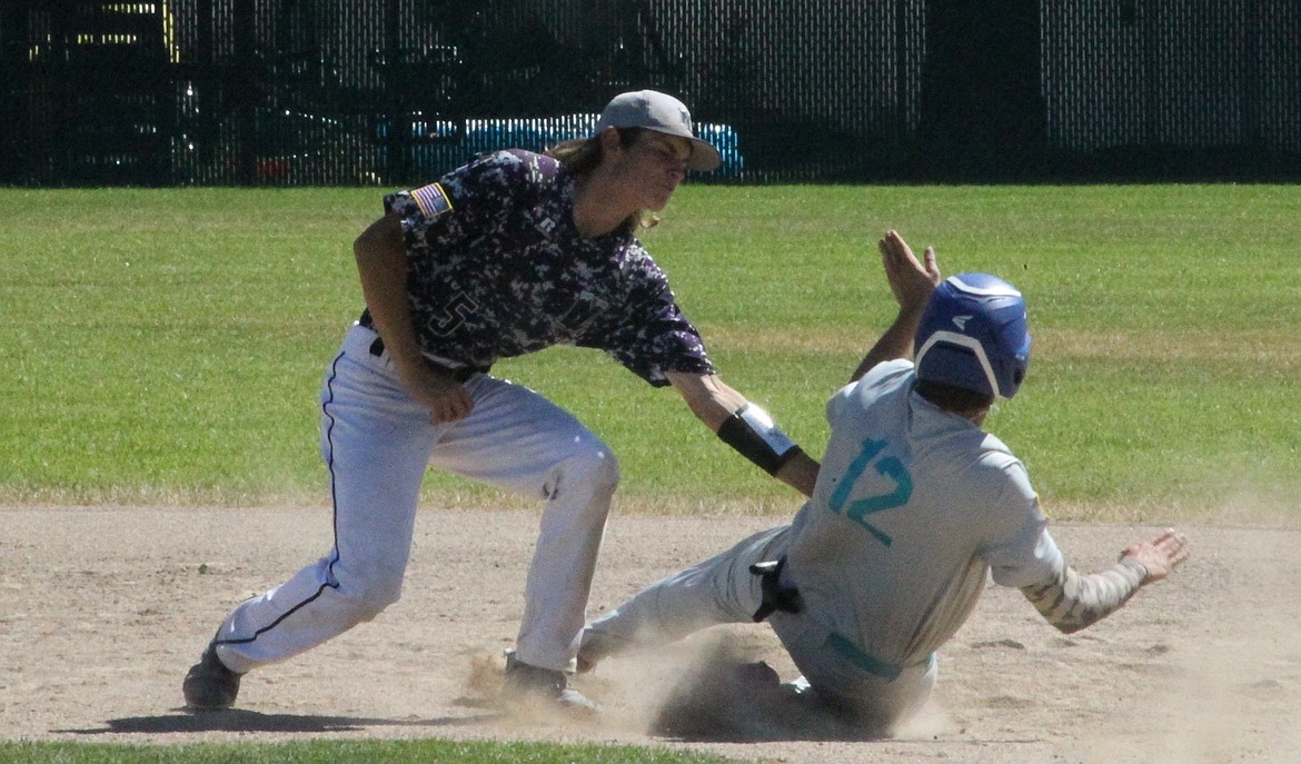 MARK NELKE/Press
Northern Lakes second baseman Andrew Horn tags out Blake Schoo of Camas Prairie trying to steal in the fifth inning of an Idaho Class A Area A (district) tournament game Friday in Rathdrum.