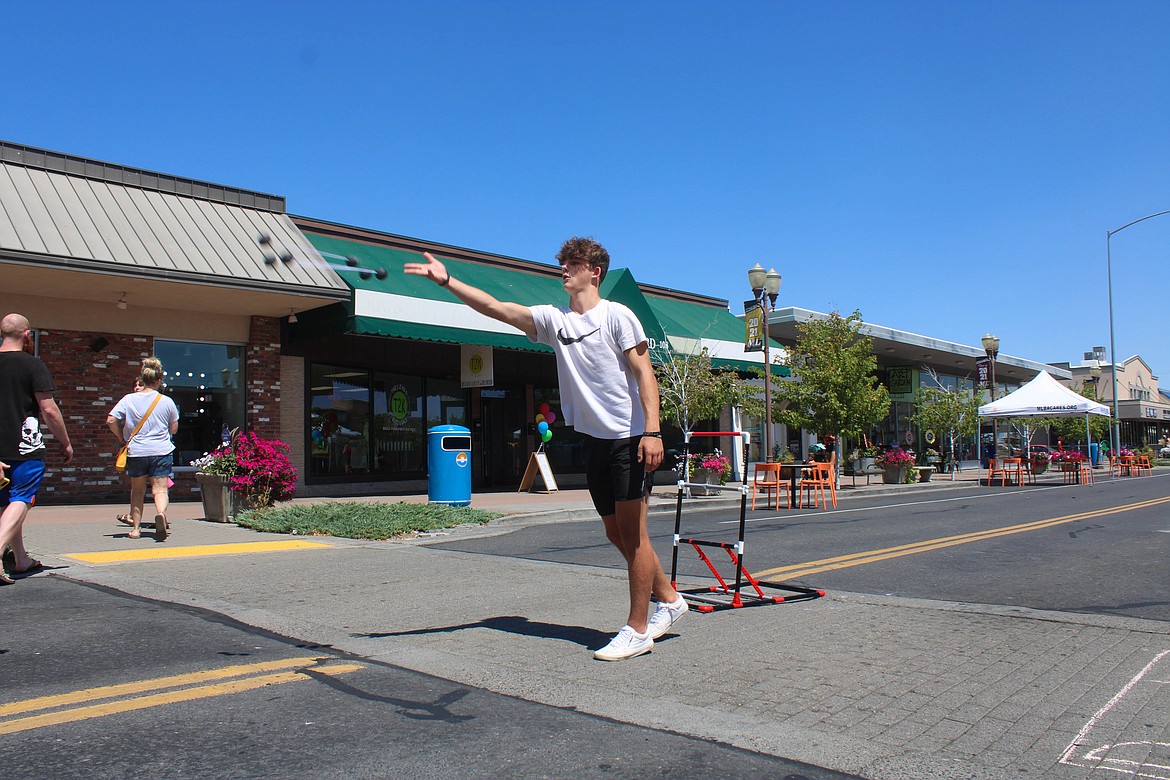 Sawyer Teney plays ladder toss at Summer Street on 3rd in Moses Lake on Saturday.