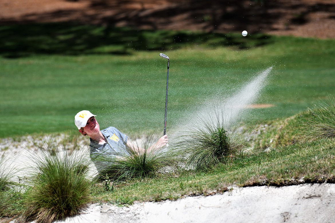 Whitefish's Billy Smith hits a ball out of the sand while recently playing at the High School Golf National Invitational at Pinehurst Resort. (Jeff Doorn photo)