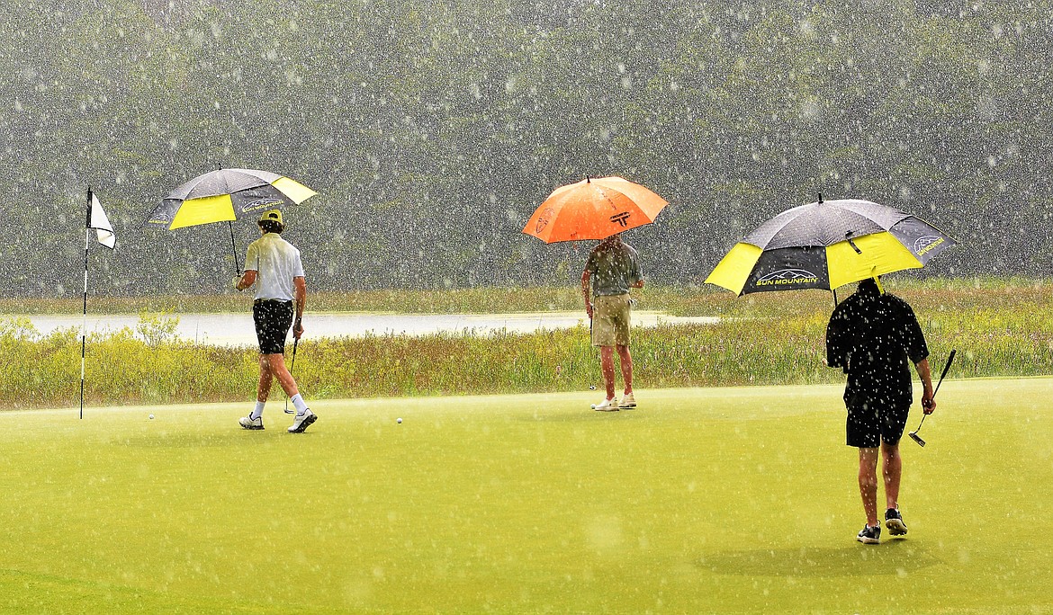 The Whitefish golf team gets caught in a rain storm while recently playing at the High School Golf National Invitational at Pinehurst Resort. (Jeff Doorn photo)