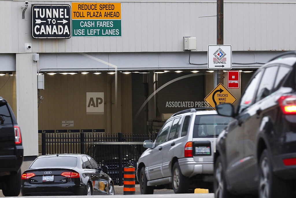 In this March 16, 2020, file photo, vehicles enter the Detroit-Windsor Tunnel in Detroit to travel to Canada. The Canada Border Services Agency has rejected a creative plan by Windsor Mayor Drew Dilkens to have Ontario residents line up inside the tunnel to get COVID-19 vaccinations. (AP Photo/Paul Sancya, File)