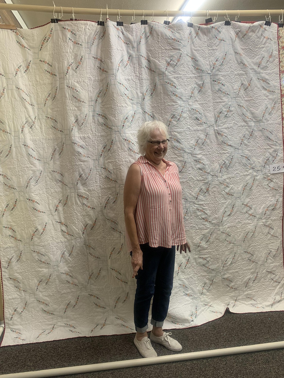 Karen Entz stands before her winning quilt at the 2021 Royal City Summerfest Quilt Show.
