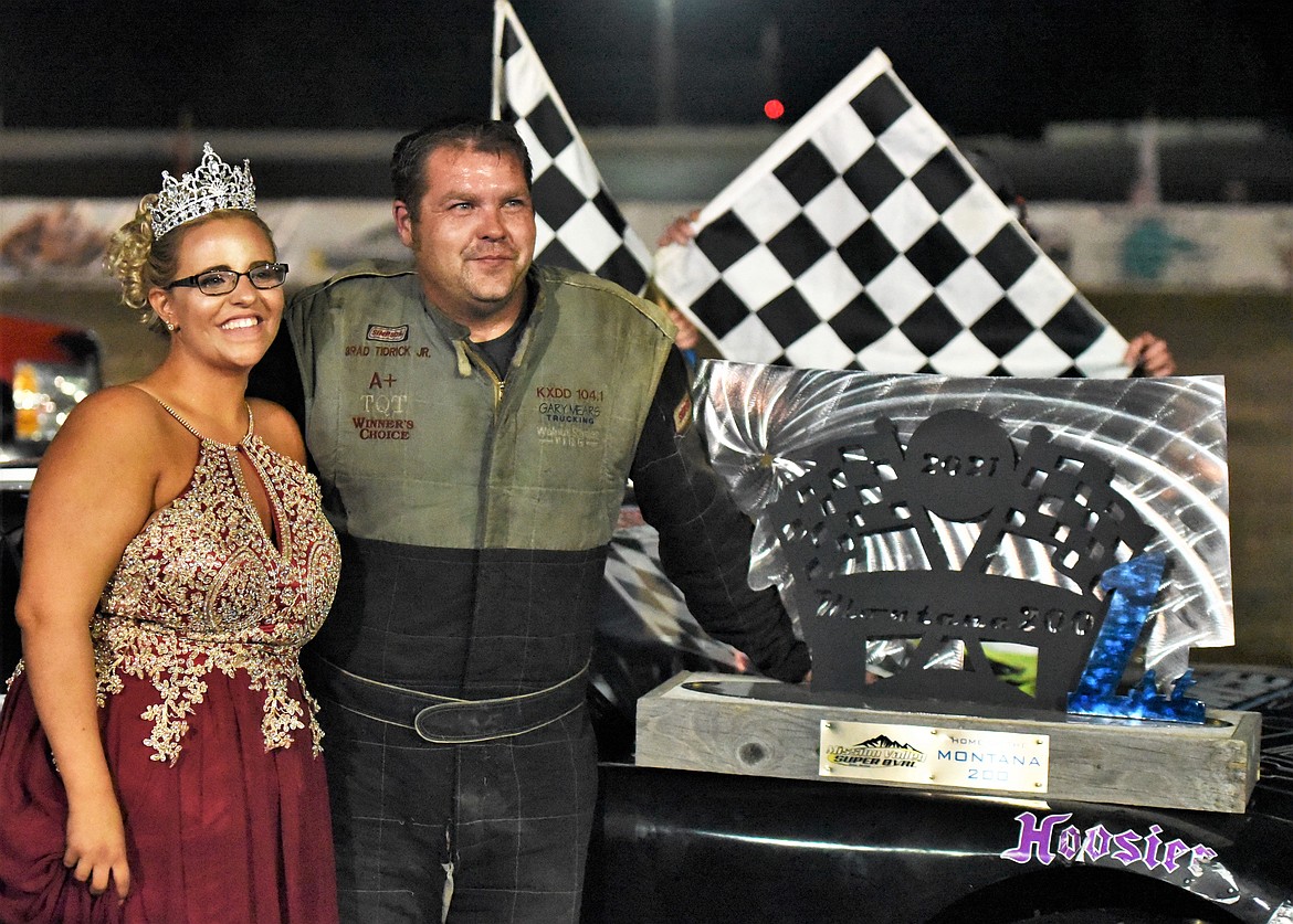 BJ Tidrick poses with Montana 200 Trophy Queen Dallas Dull of Columbia Falls after his win Saturday. Tidrick also won the 2005 Montana 200 in Kalispell. (Scot Heisel/Lake County Leader)