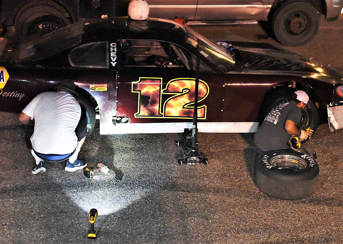 After the first 100 laps, crews had 15 minutes to make mid-race adjustments on the track in front of the audience. (Scot Heisel/Lake County Leader)