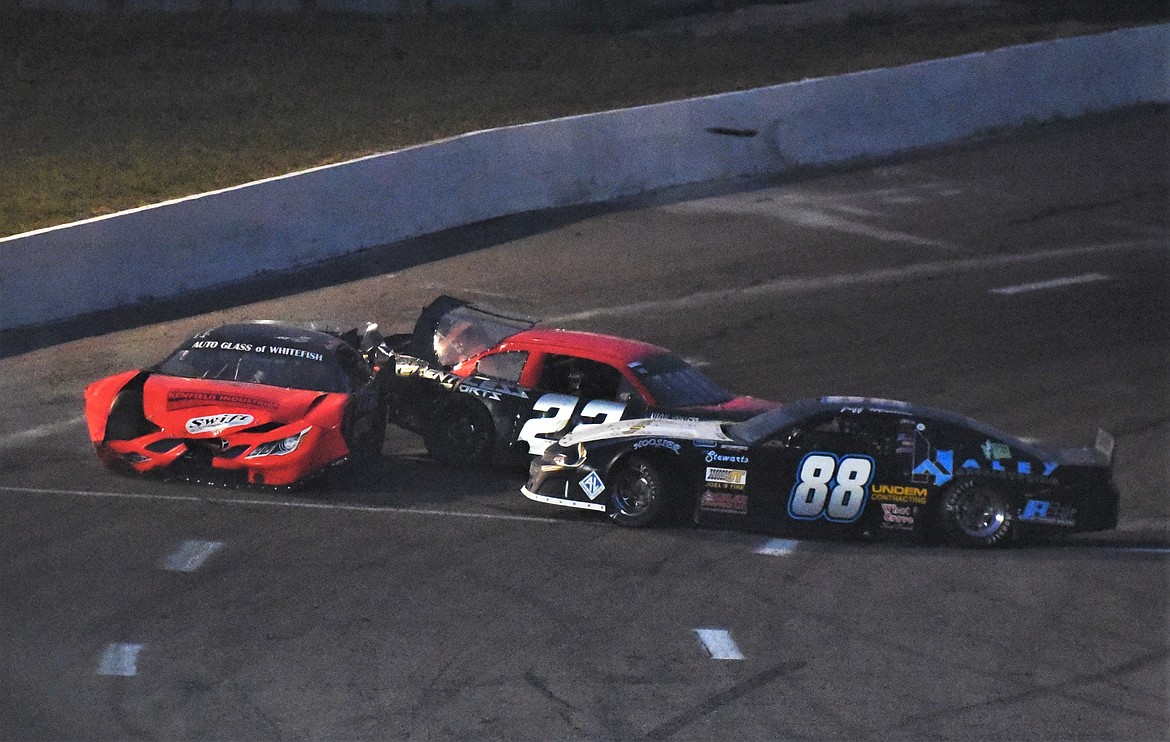 A crash in turn 4 on lap 71 knocked out Agni Howell of Kalispell, JD Undem of Frenchtown (22) and Jeff Mullins of Naches, Wash. (88). (Scot Heisel/Lake County Leader)