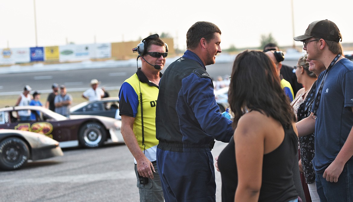 Driver Derek Undem shakes hands with sponsors and race officials in front of his father, track operator Tony Undem prior to the race. Derrick Undem finished seventh. His brother, JD, finished 13th. (Scot Heisel/Lake County Leader)