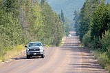 In the North Fork, a tale of two roads: As traffic surges, untreated lower road is battered