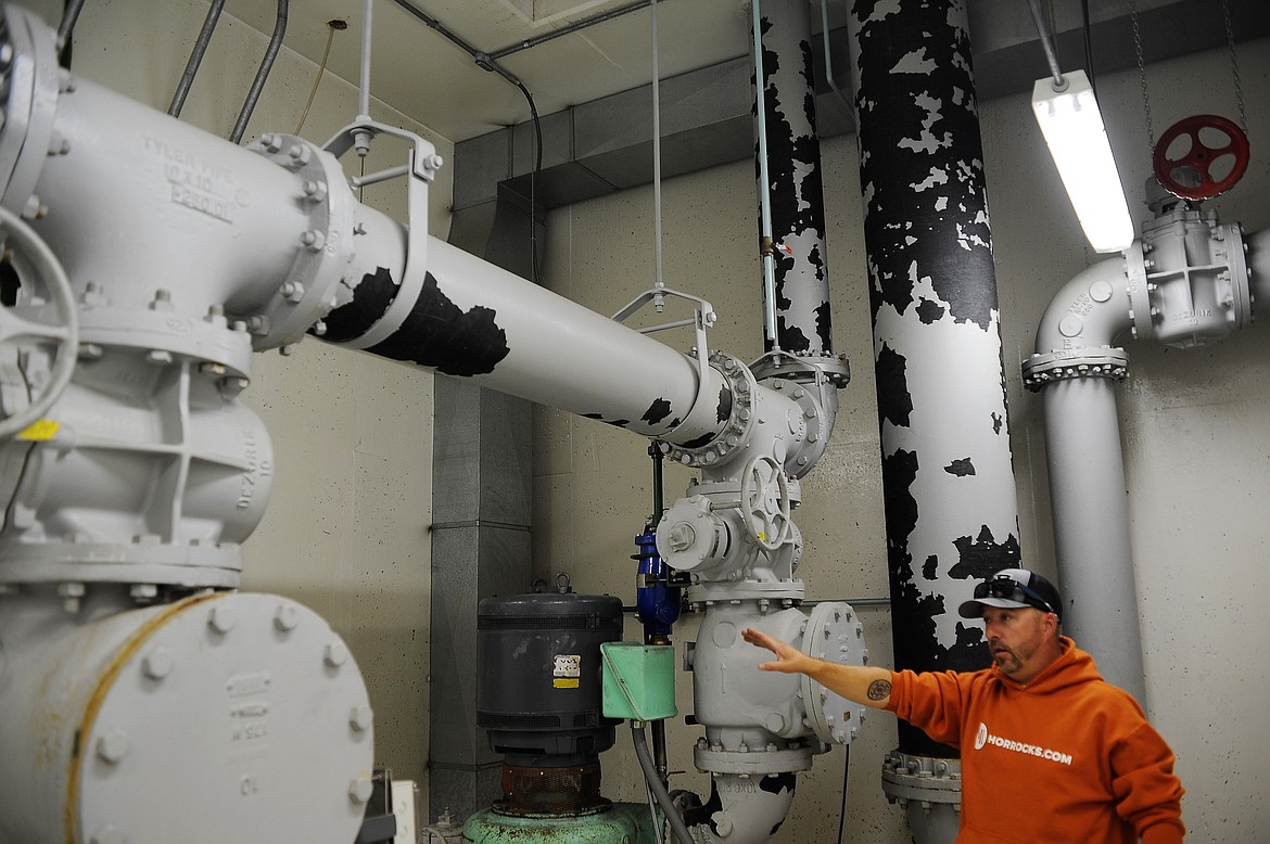 Chad Wambach, assistant field supervisor for the Evergreen Water and Sewer District, explains how wastewater moves through a lift station behind the Snappy Sport Senter on Wednesday, July 21, 2021. The station is the district's main wastewater collection site, where all of Evergreen's sewer water is pumped to a treatment facility in Kalispell. (Chad Sokol/Daily Inter Lake)