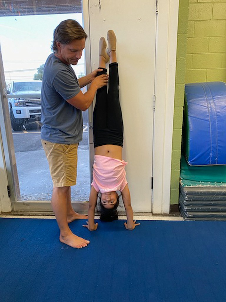 Toby Black works with one of his dance students at Dance FX and Scholastic FX dance studio in Moses Lake.