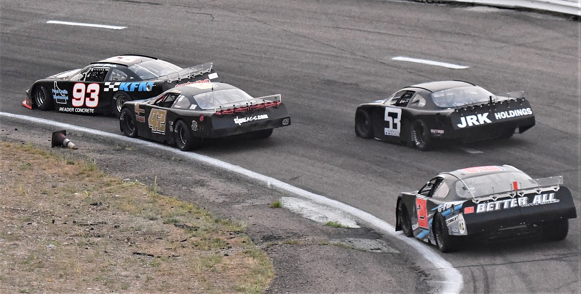 Race leader Dave Garber (93) gets a bit sideways in front of Garrett Huffines (42) in turn 1. Garber straightened the car out, but it cost him the lead. (Scot Heisel/Lake County Leader)