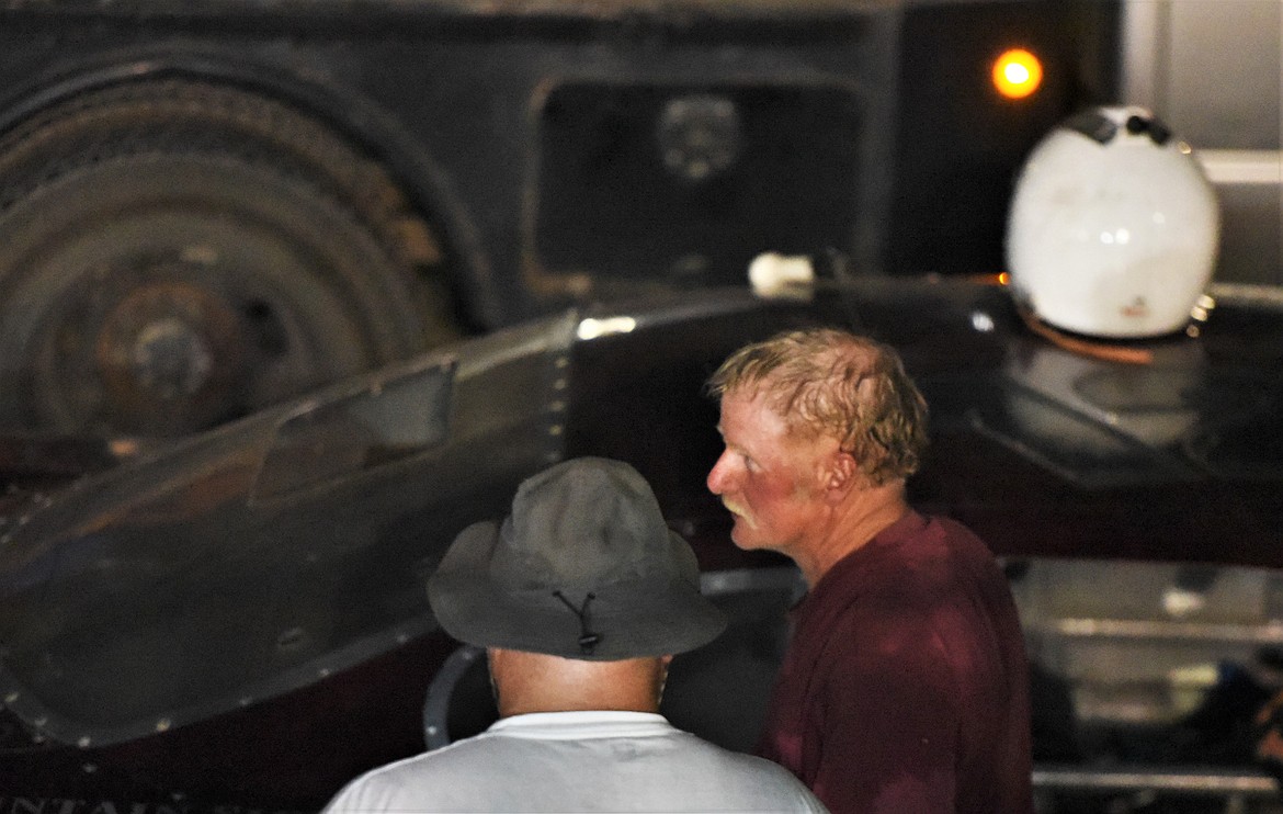 Cory Wolfe of Ronan talks with his crew during the 15-minute halftime pit stop. (Scot Heisel/Lake County Leader)