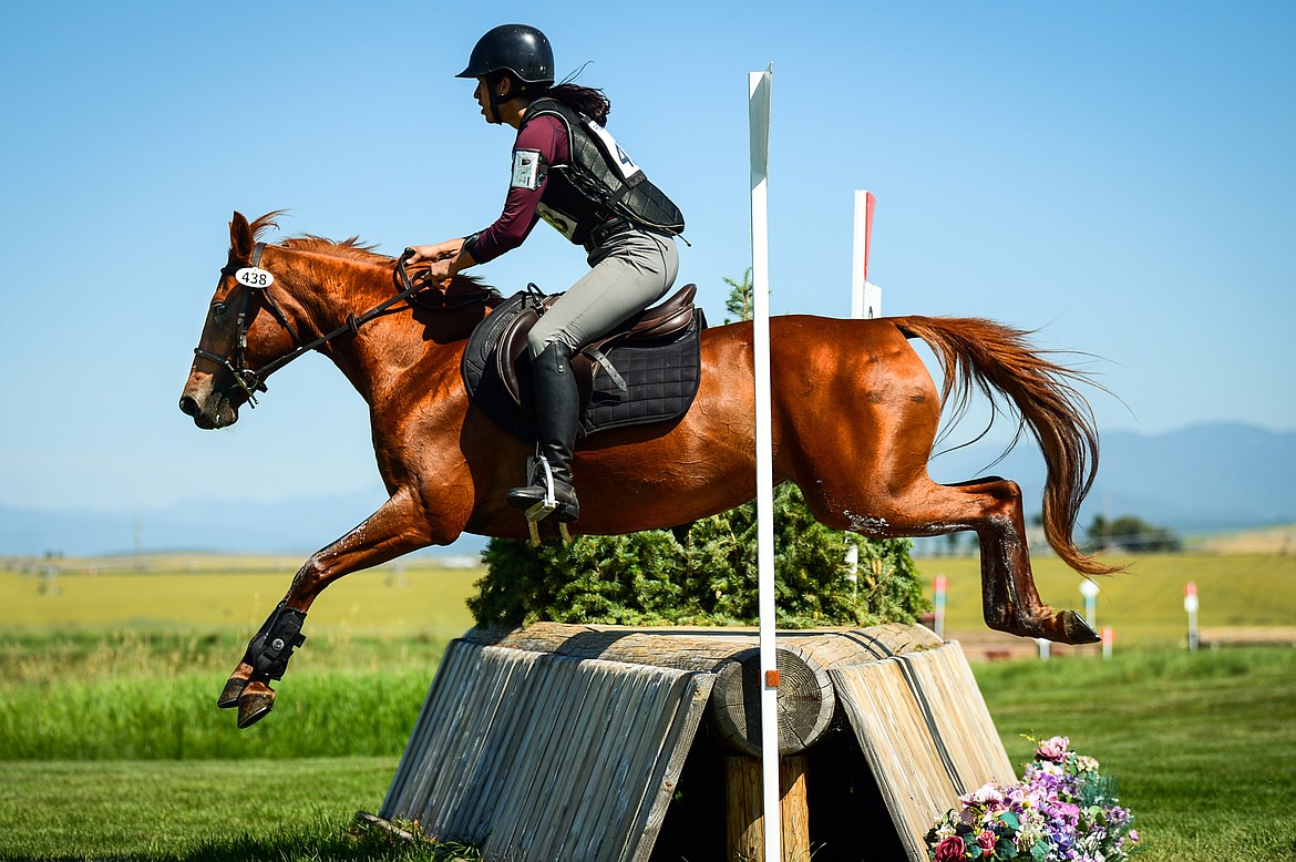 Heather Schiedermayer and Wildfire clear a jump during Senior Open Novice D cross-country at The Event at Rebecca Farm on Thursday, July 22. (Casey Kreider/Daily Inter Lake)