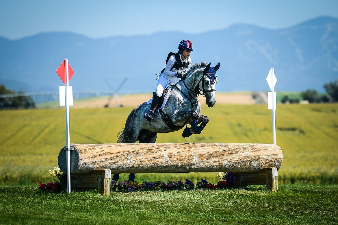 Kira De Torres and The Great Gatsby clear a jump during Senior Open Novice D cross-country at The Event at Rebecca Farm on Thursday, July 22. (Casey Kreider/Daily Inter Lake)