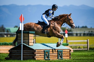 Alexandra Thompson clears a jump on Oliver Money during Senior Open Novice D cross-country at The Event at Rebecca Farm on Thursday, July 22. (Casey Kreider/Daily Inter Lake)