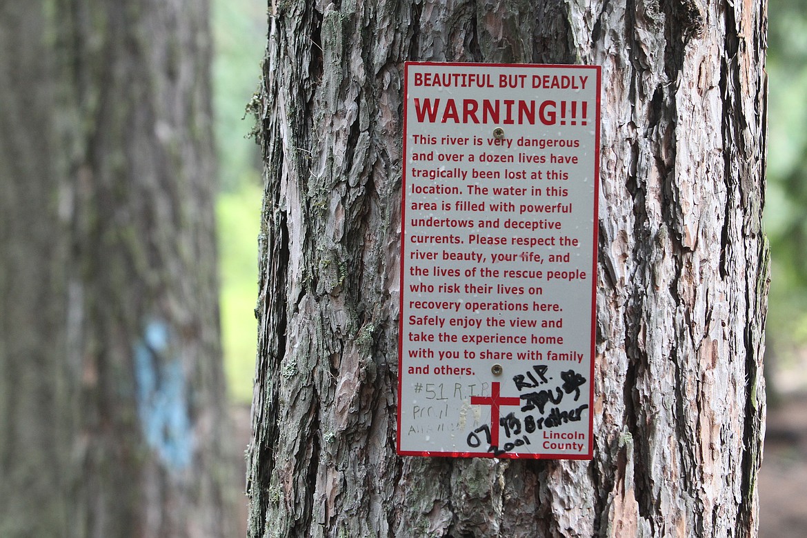 A sign warns recreationists approaching Kootenai Falls of the dangers of falling into the river. Officials with Lincoln County Sheriff's Office said a possible drowning occurred Tuesday. (Will Langhorne/The Western News)(Will Langhorne/The Western News)