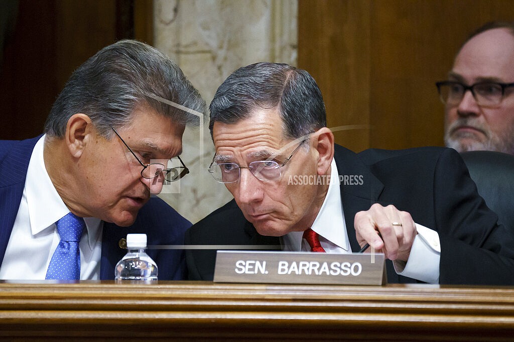In this June 23, 2021, file photo, Sen. Joe Manchin, D-W.Va., chair of the Senate Energy and Natural Resources Committee holds a hearing with Ranking Member Sen. John Barrasso, R-Wyo., right, at the Capitol in Washington. A former federal law enforcement officer is alleging that President Joe Biden's pick to oversee federal lands in western states stonewalled a 1989 investigation into the sabotage of an Idaho timber sale. The allegation against U.S. Bureau of Land Management nominee Tracy Stone-Manning was made in a letter from a retired investigator released Thursday, July 15, 2021, by Sen. Barrasso. (AP Photo/J. Scott Applewhite, File)