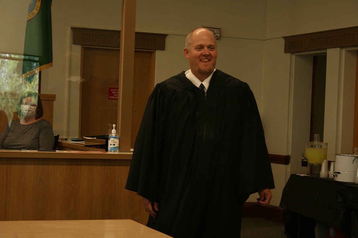 New Grant County District Court Judge Brian Gwinn smiles at his swearing-in ceremony at the Grant County Courthouse in Ephrata Thursday.