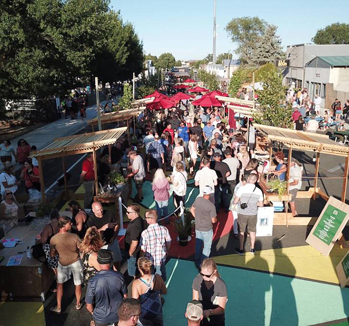 Pedestrians fill Quincy’s B Street during the Quincy Better Block event.