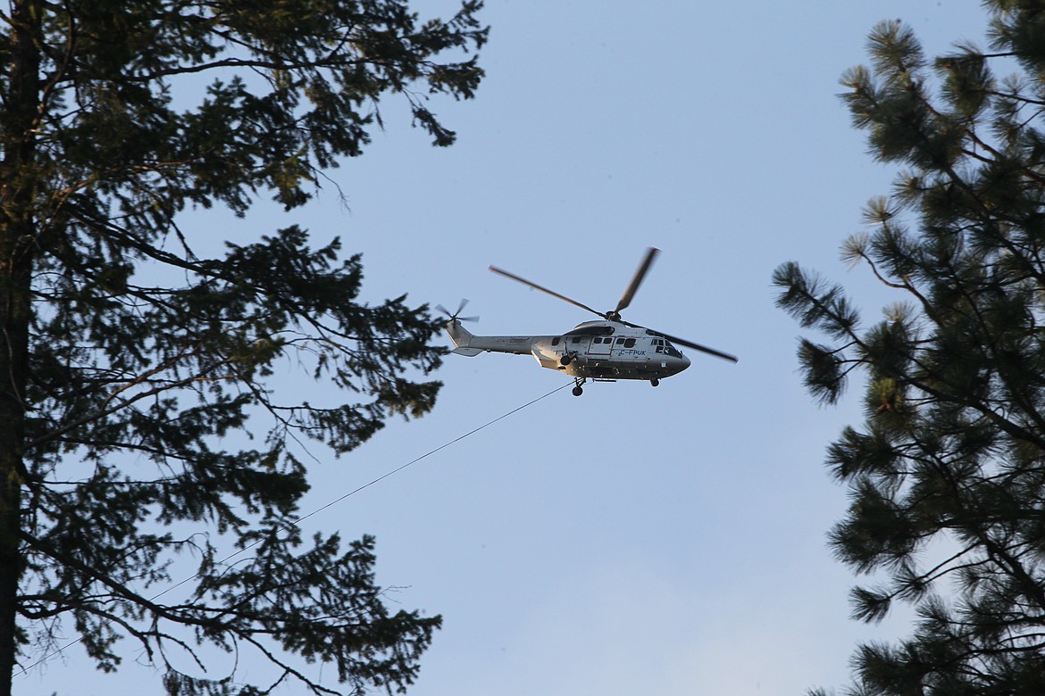 A helicopter drops water on the South Yaak Fire on July 23. U.S. Forest Service officials confirmed that Lincoln County Sheriff's  deputies had begun evacuation for residents living along Kilbrennan Lake Road. (Will Langhorne/The Western News)