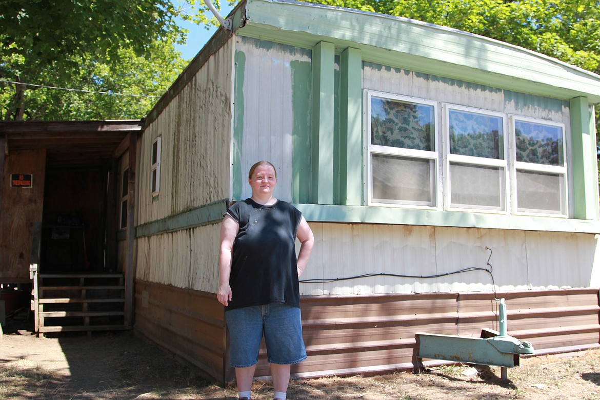 Natasha Chapel stands in front her mobile home on June 30. By August 31, she will have to have moved out of Troy Mobile Home Park according to the terms of a termination of tenancy notice. (Will Langhorne/The Western News)