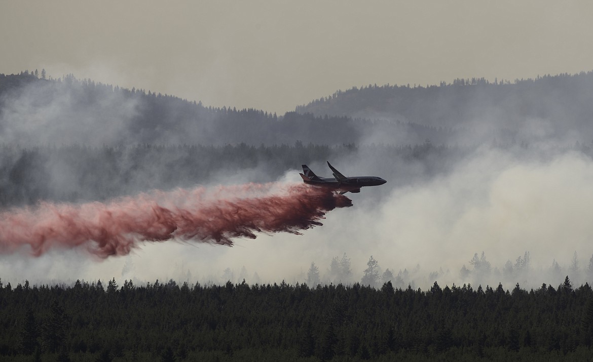 Paul Webster took this photo of a Boeing 737 dropping fire retardant on the fire near Diagonal Road outside Rathdrum. Courtesy photo