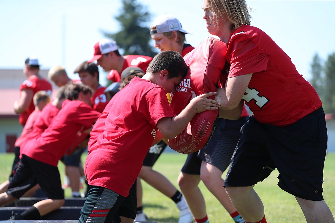 Campers participate in offensive drills on Friday.
