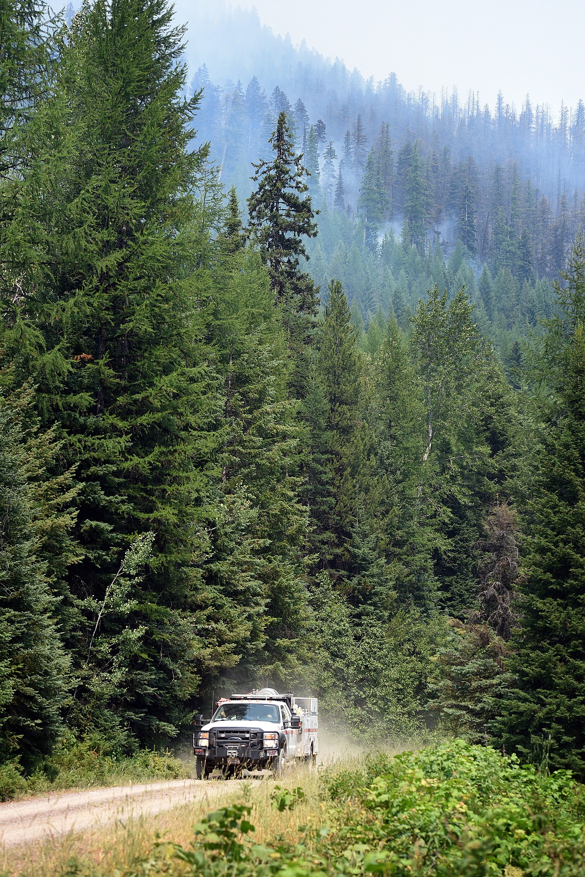 A National Forest Service fire engine from Florida patrols the Hay Creek Fire near Polebridge Saturday. Large fires throughout the western U.S. have left resources spread thin for the agency. (Jeremy Weber/Daily Inter Lake)