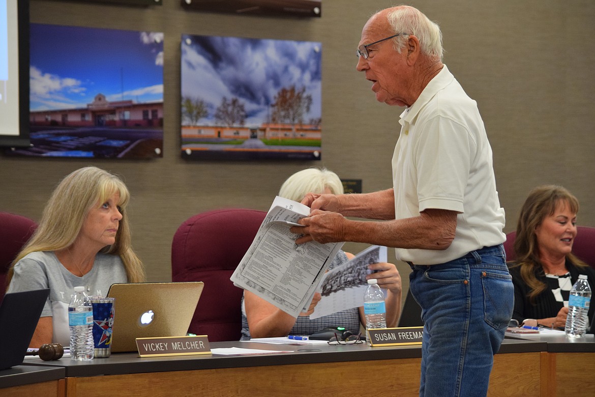 Former Washington State Legislator Harold Hochstatter, right, argues with Moses Lake School Board President Vickey Melcher over where he should speak during a public comment period at the board’s regular meeting on Thursday.