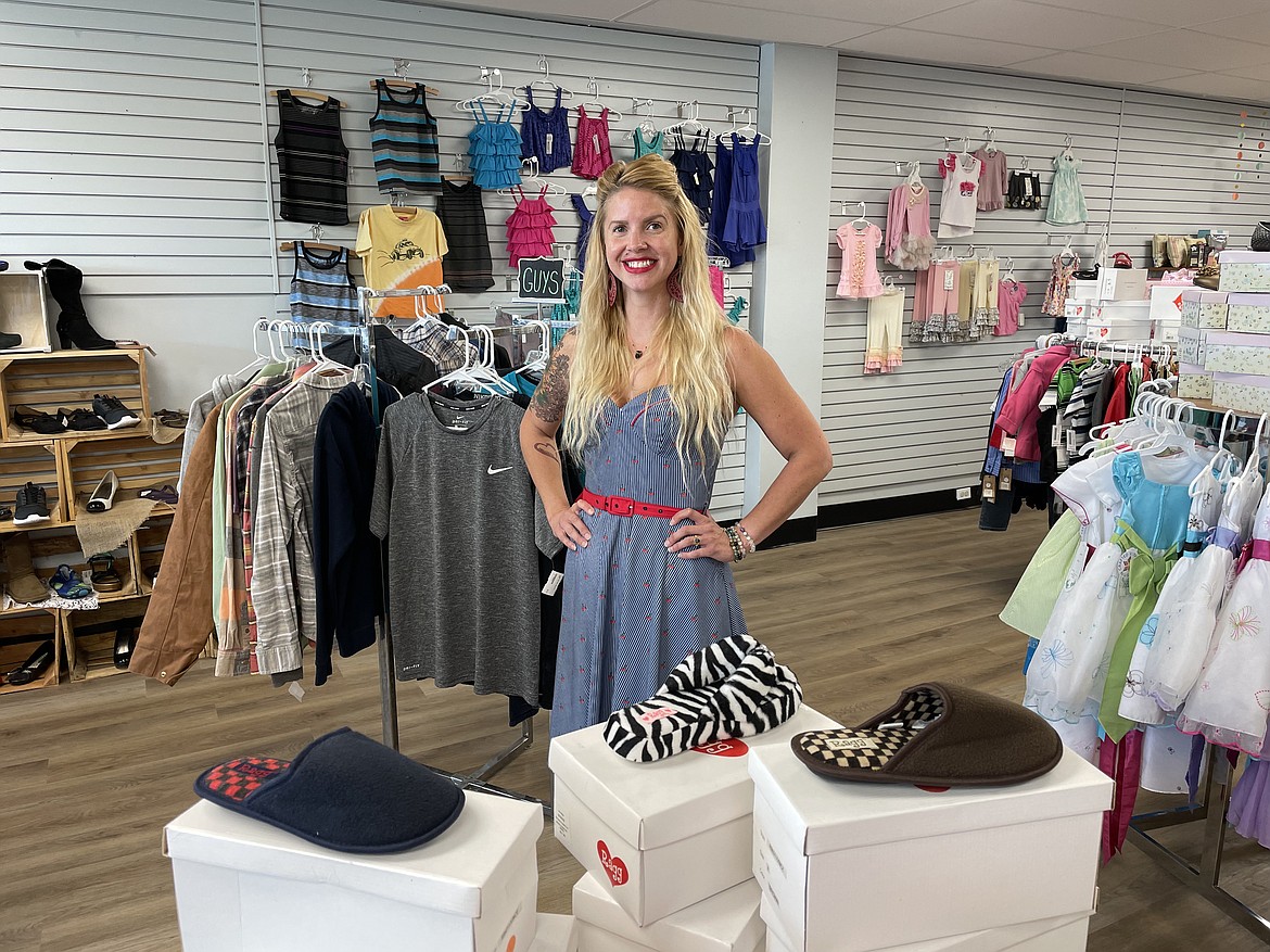 Acashia Crowell, owner of used clothes and toy store Tyke’s 2 Kid’s, stands in her remodeled downtown Moses Lake store.