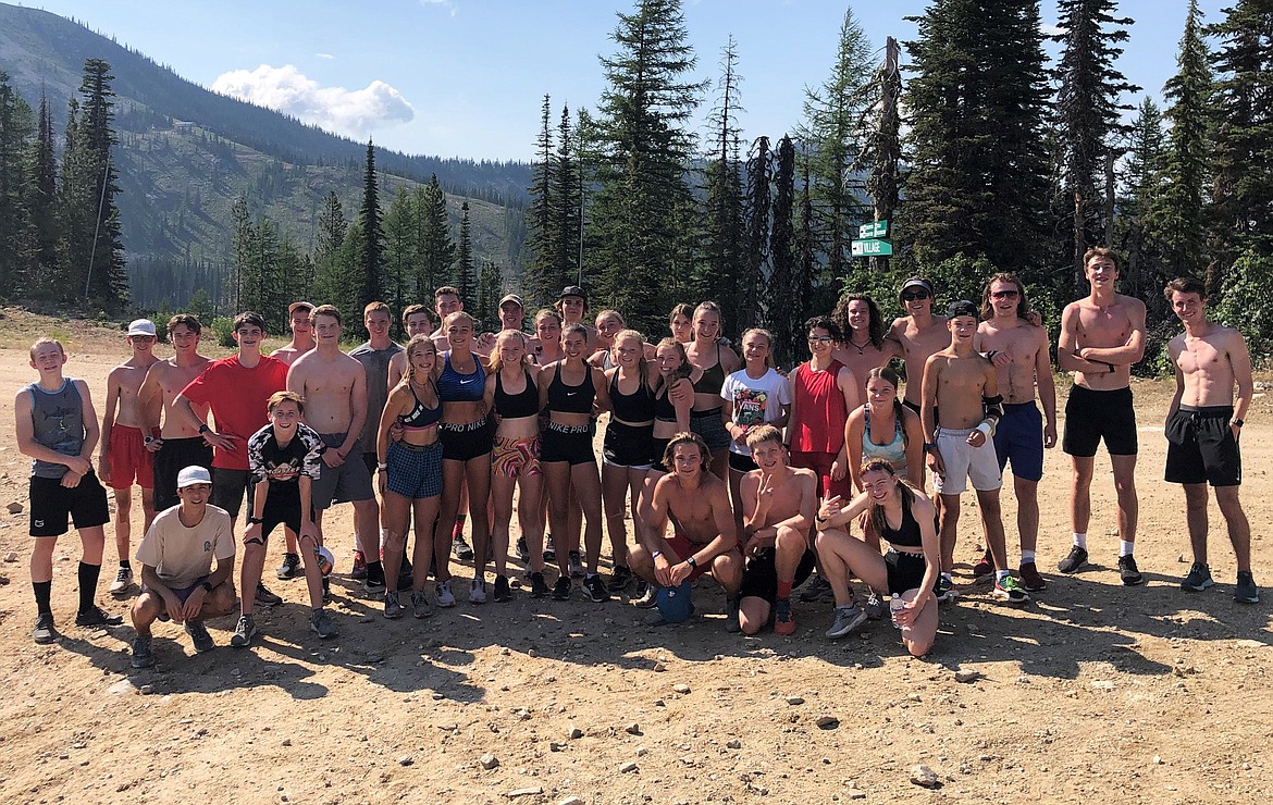The Bulldogs pose for a photo after completing a team hill climb at camp last week. The team jumped into Colburn Lake once they reached the top.