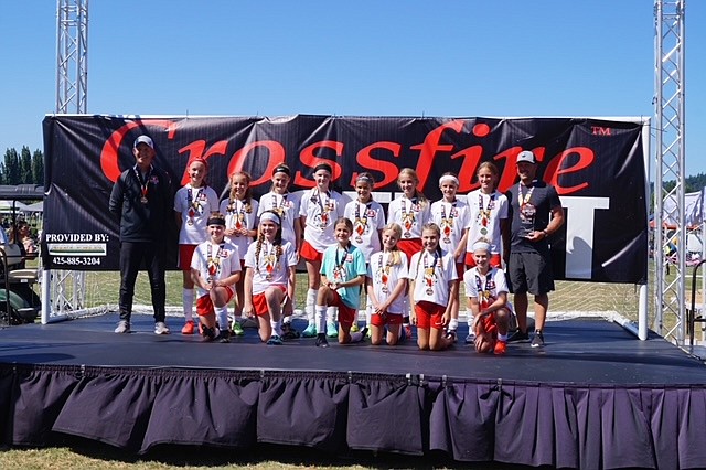 Courtesy photo
The Thorns North 09 Red girls soccer team went undefeated in the Crossfire Select tournament over the weekend in Redmond, Wash. In the top row, from left: coach Ty Kovatch, Taryn Young, Tayla Rutchi, Chloe Burkholder, Nell Hutchins, Mallory Morrisroe, Katie Kovatch, Sierra Sheppard, Ava Roberts and coach Dan Linder. In the bottom are: 
Ryann Blair, Phinalley Voigt, Savannah Spencer, Lucia Barton, Audrey Linder and Aspen Liddiard.