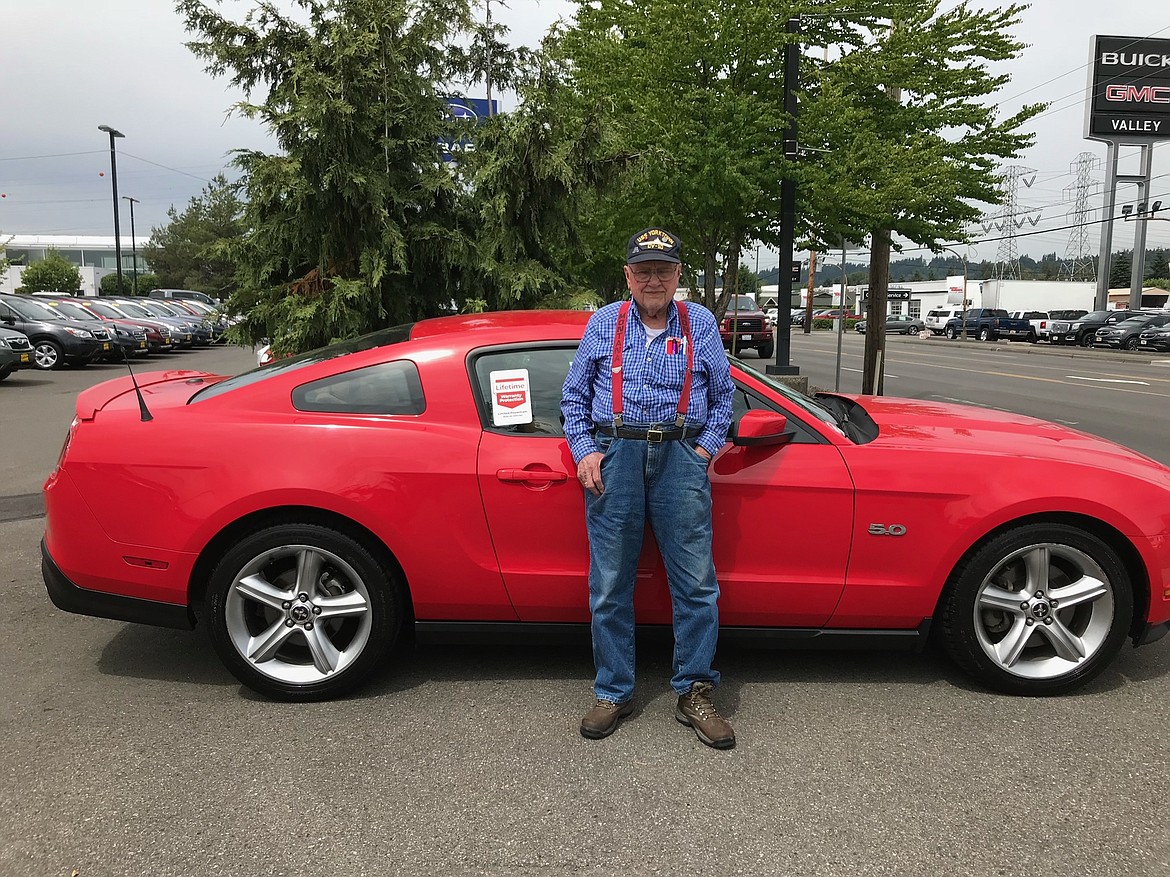 Bob Hooper poses with his 2011 Ford Mustang GT that will be on display at the Evergreen Show 'N Shine Car Show along with a number of other Mustangs from the Hooper family. Bob passed away May 29 at age 97, but was still driving up until three months before he died. (Courtesy photo)