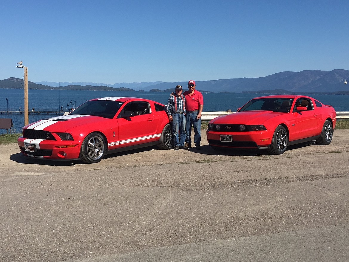 Bob Hooper Jr. and his son Bob pose with their Mustangs. A number of the Hooper Mustangs will be on display at the Evergreen Show 'N Shine Car Show Aug. 7. (Courtesy photo)