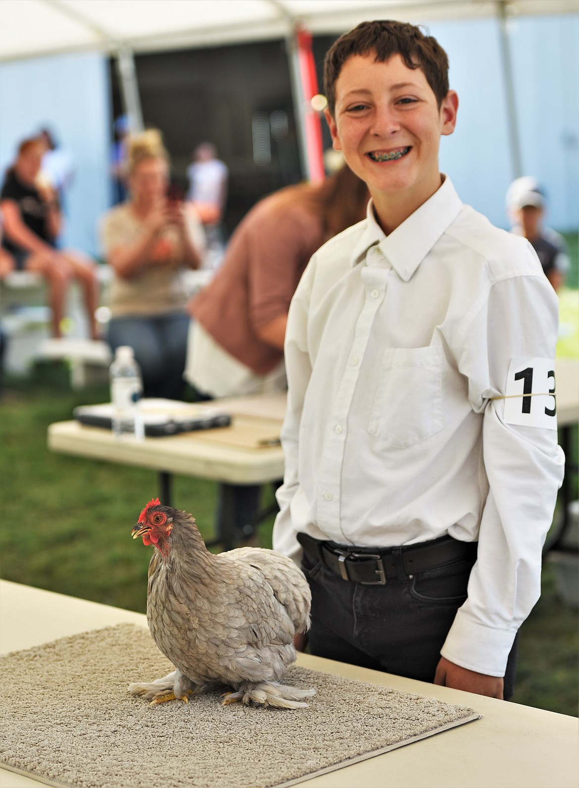 Toby Cantlon brought his grand champion blue cochin bantam to the small animal round robin and earned a reserve champion ribbon. (Scot Heisel/Lake County Leader)