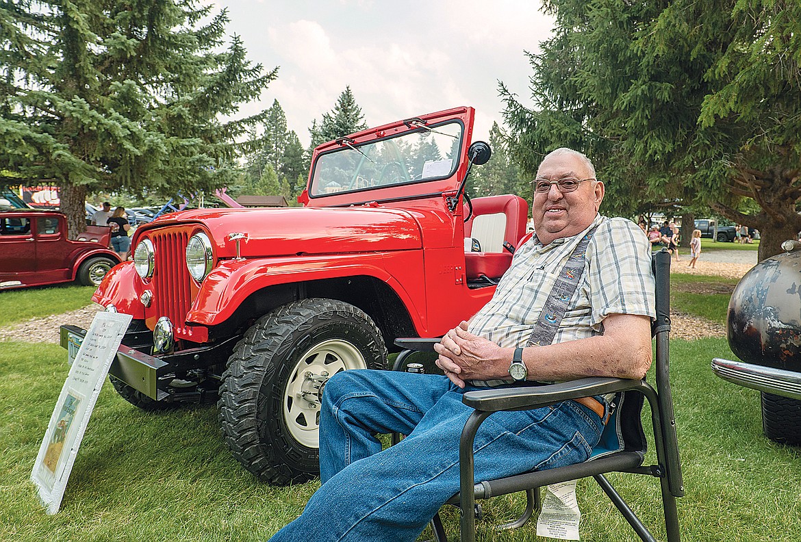Cliff Sedivy with his vintage Willys Jeep at the car show.