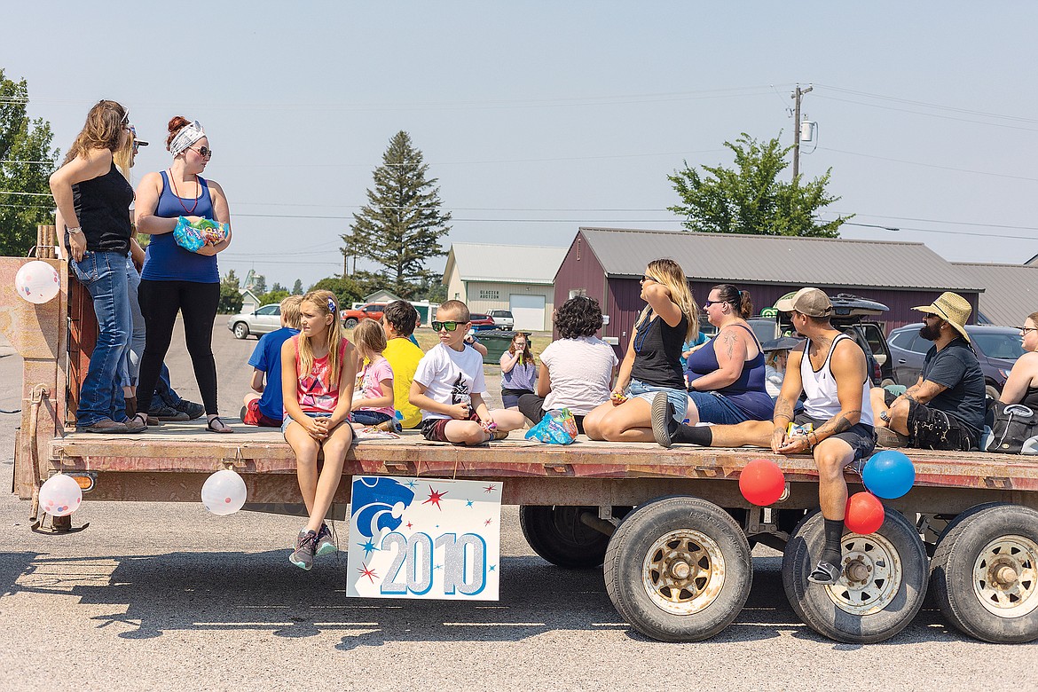 The class of 2010-2011 rides on a flatbed trailer.