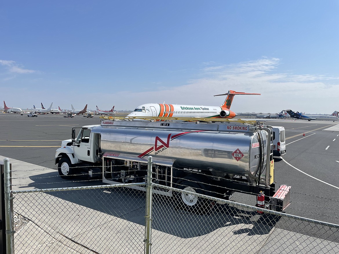 An Avfuel refueling and tanker truck sits in front of the Erickson Aero Tanker MD87 firefighting plane on the ramp at the Grant County International Airport on Wednesday.