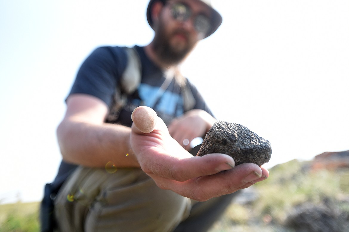 Zane Rhyneer shows off the hadrosaur toe recently uncovered by NorthWest Montana Fossils. (Jeremy Weber/Daily Inter Lake)