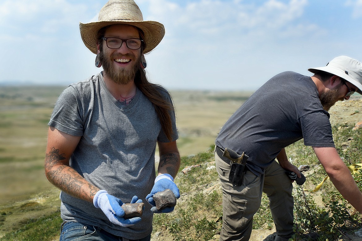 NorthWest Montana Fossils owner Aamon Jaeger (left) and Zane Rhyneer pull dinosaur bones from their dig site east of the Divide. (Jeremy Weber/Daily Inter Lake)