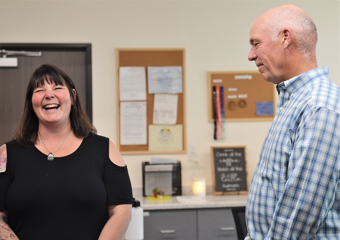 Lisa Wall-Wilbert, founder and owner of Fun and Fancy Free Learning Center, visits with Gov. Greg Gianforte, who visited her facility Monday. (Carolyn Hidy/Lake County Leader)