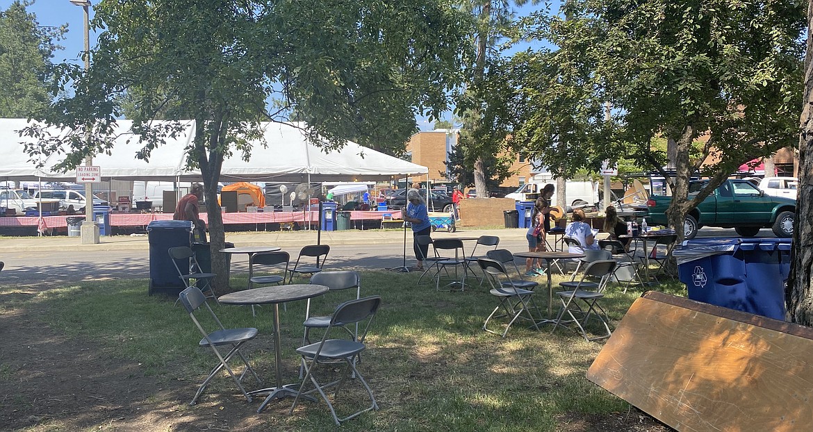 The grounds of North Idaho College are a bustle of activity as setup takes place Thursday for a trio of downtown events, starting today.