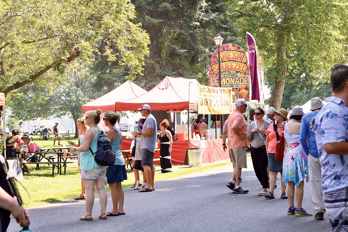 Locals and people from around the U.S. flocked to City Park on Friday to enjoy the Taste of Coeur d'Alene which runs until Sunday. HANNAH NEFF/Press