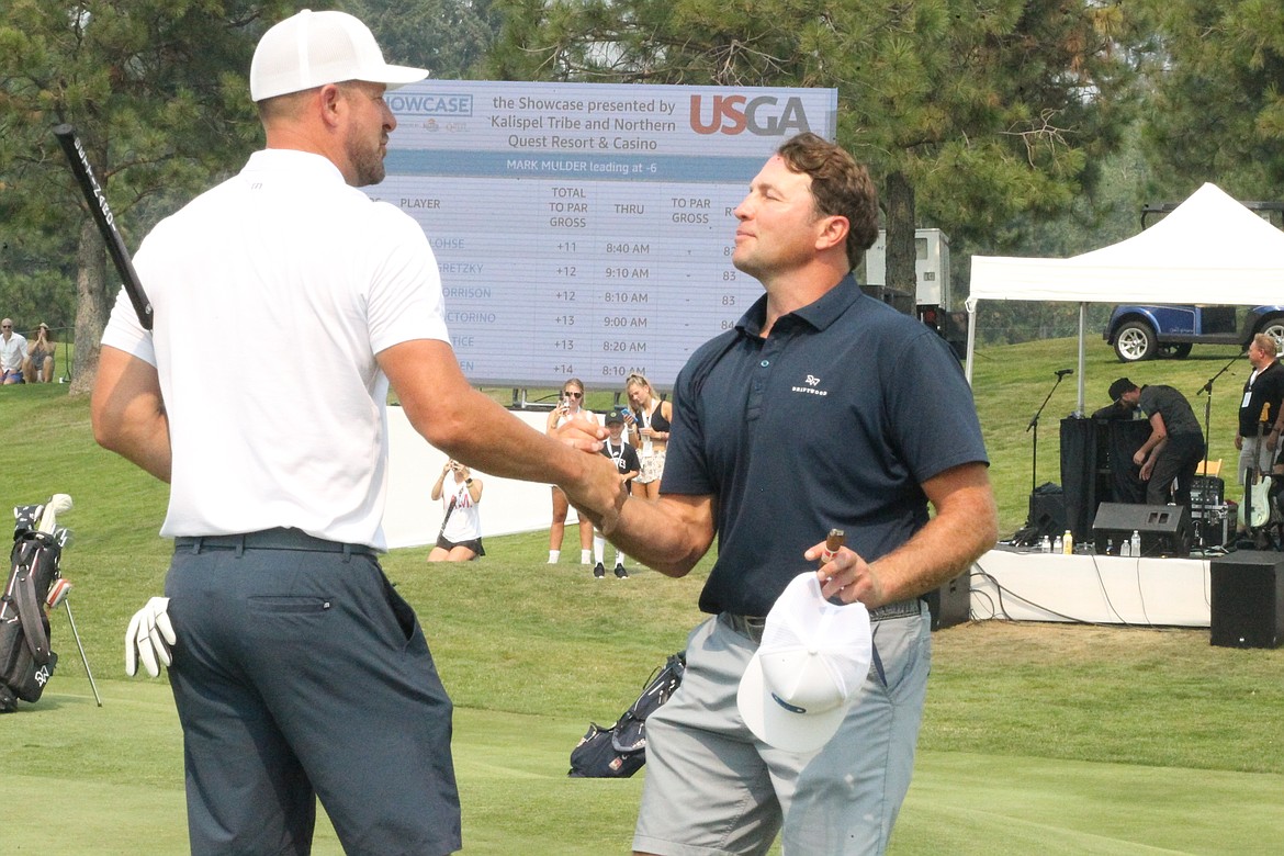 JASON ELLIOTT/Press
Former Major League Baseball pitcher Mark Mulder, left, shakes the hand of former NHL player Brenden Morrow after Mulder's victory at The Showcase golf exhibition on Saturday at The Coeur d'Alene Resort Golf Course.