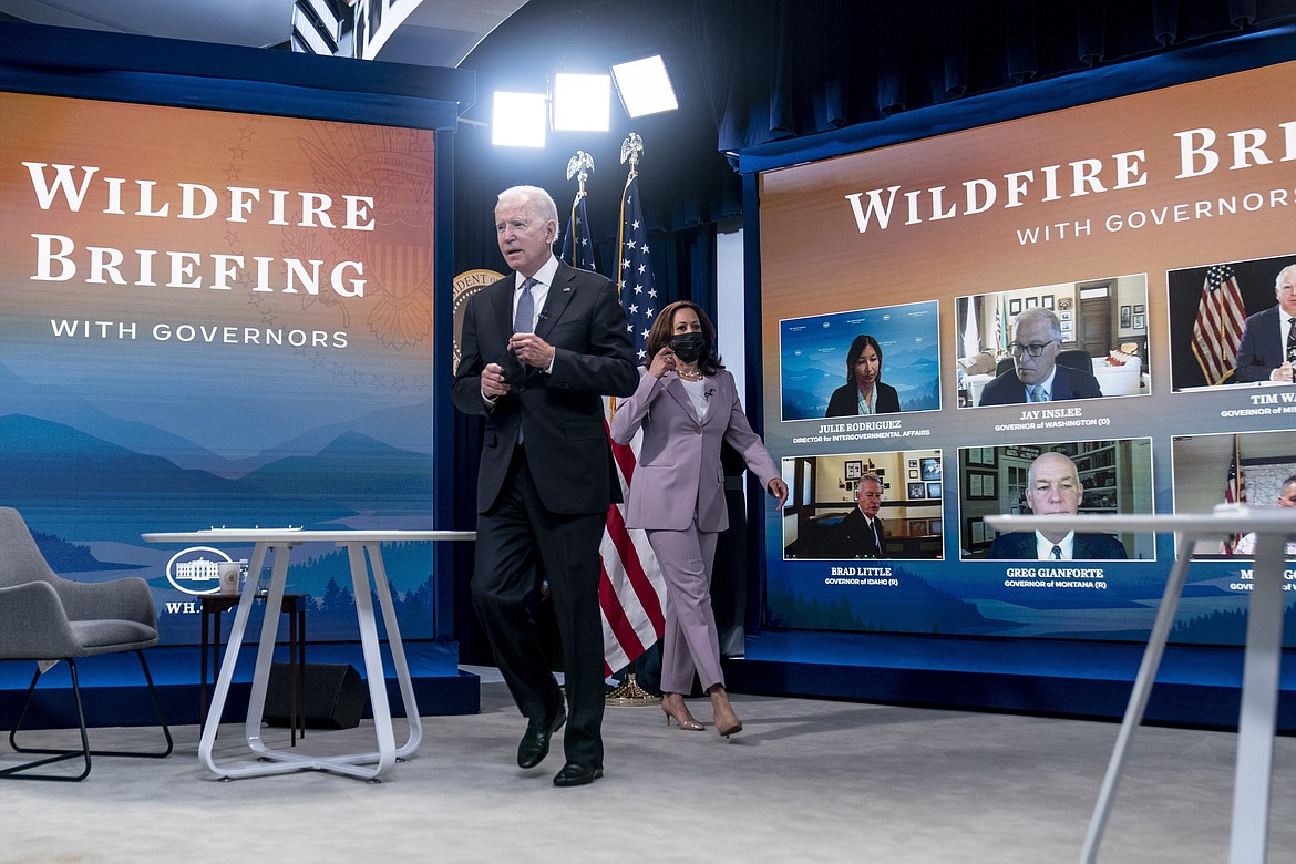 President Joe Biden and Vice President Kamala Harris arrive for a meeting with governors to discuss ongoing efforts to strengthen wildfire prevention, preparedness and response efforts, and hear firsthand about the ongoing impacts of the 2021 wildfire season in the South Court Auditorium in the Eisenhower Executive Office Building on the White House Campus in Washington, Friday, July 30, 2021. (AP Photo/Andrew Harnik)