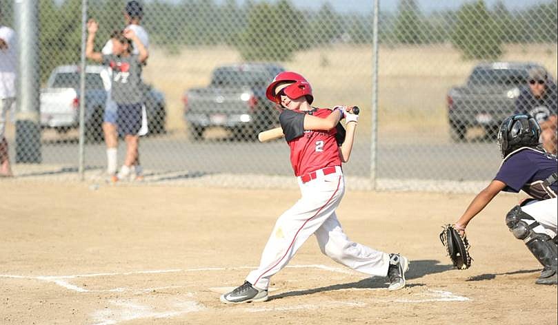 Benson Brown swings during the championship game against Brewster on July 25.