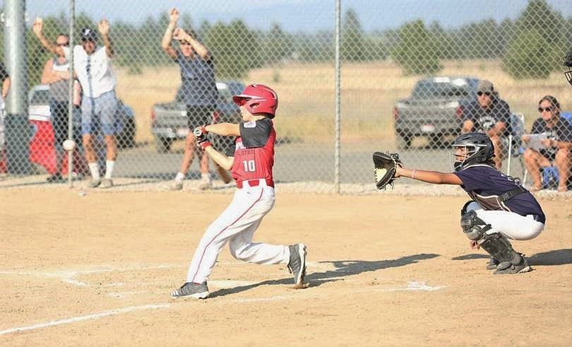 Blake Bogadi takes a cut during the championship game against Brewster.