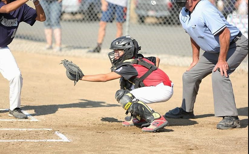 Catcher Jack Schriber prepares to receive a pitch during the championship game against Brewster.