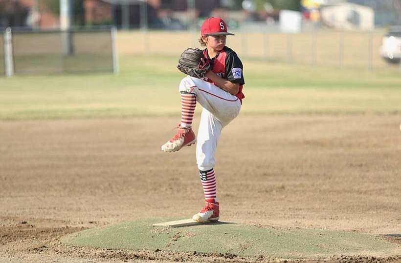 Landon Day prepares to throw a pitch during the championship game against Brewster.